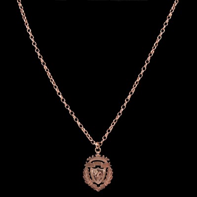 Lot 285 - A 9 carat rose gold shield fob on a chain.