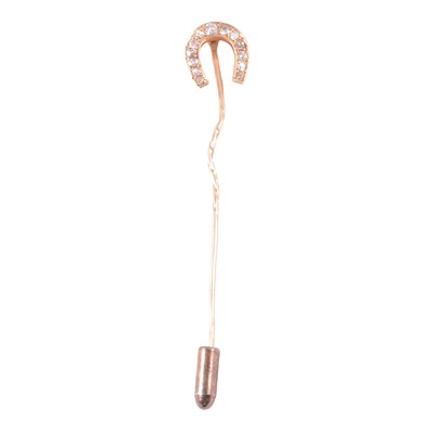 Lot 364 - A diamond set horseshoe stick pin.