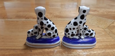 Lot 4 - Pair of Staffordshire dog pen stands, and another pair of smaller dalmation dogs