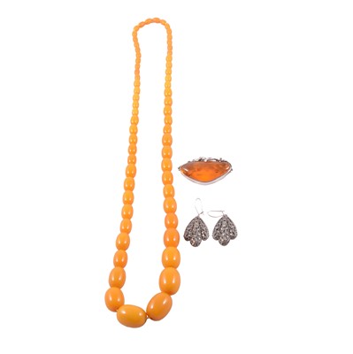 Lot 337 - A butterscotch amber–coloured bead necklace, amber brooch and pair of marcasite earrings.