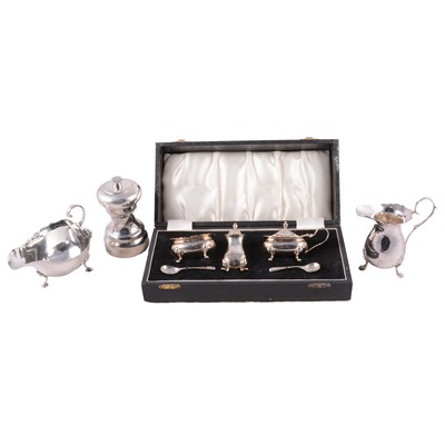 Lot 239 - Silver three piece cruet, two silver jugs and a silver pepper mill