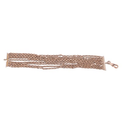Lot 215 - A yellow metal nine strand belcher link bracelet with swivel fastener.