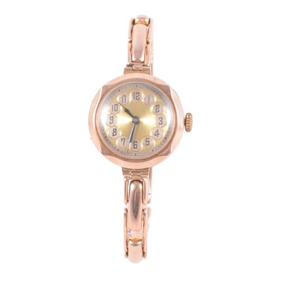Lot 448 - A lady's vintage 9 carat rose gold wristwatch with expanding bracelet.