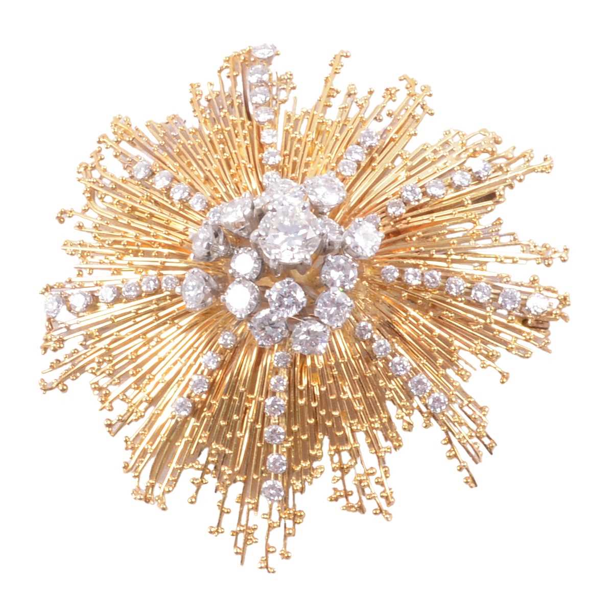 Lot 162 - David Thomas - An 18 carat yellow gold starburst diamond set brooch.