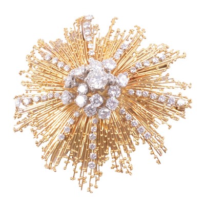 Lot 162 - David Thomas - An 18 carat yellow gold starburst diamond set brooch.