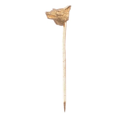 Lot 371 - A yellow metal fox head stick pin.