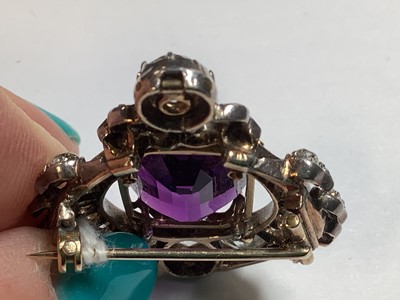 Lot 174 - A Victorian amethyst and diamond brooch.