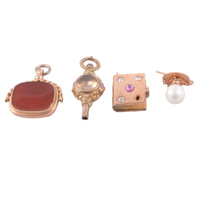 Lot 360 - A cornelion fob, pearl tie stud, metal watch key, and diamond set locket with magnifier.