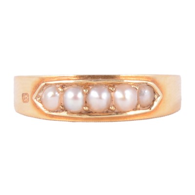 Lot 24 - A pearl five stone half hoop ring.