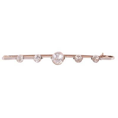 Lot 165 - A five stone diamond bar brooch.