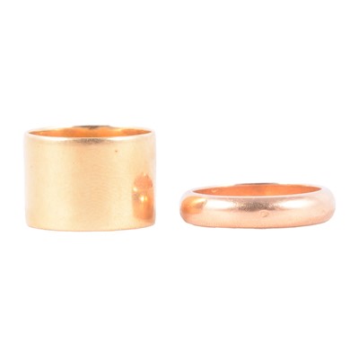 Lot 121 - A French gold wedding ring, and another yellow metal ring.