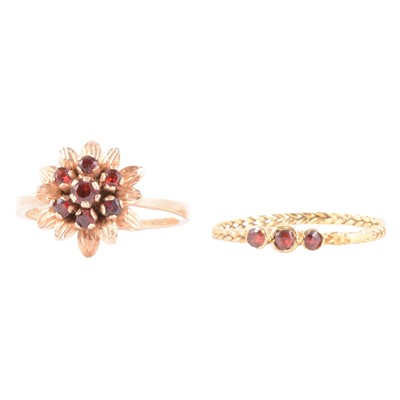 Lot 30 - Two garnet dress rings.