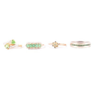 Lot 52 - Four emerald / green gemstone rings.