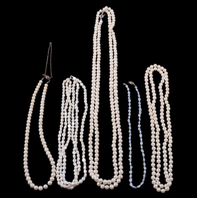 Lot 323 - Two ropes of cultured pearls, two cultured freshwater pearl necklaces, and simulated pearls.