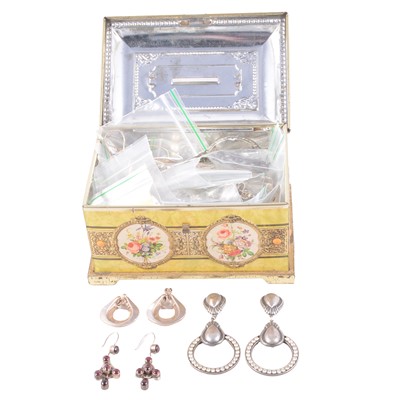 Lot 483 - A collection of silver and white metal earrings, some gemset, in a vintage tin moneybox.