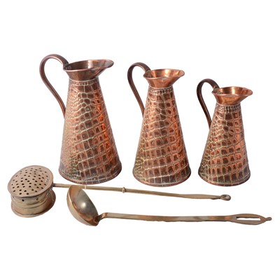 Lot 120 - Set of three graduating copper jugs, brass chestnut roaster and a ladle