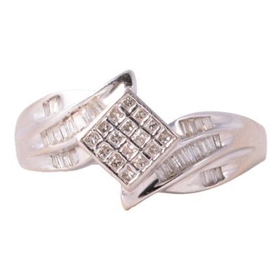 Lot 97 - A modern diamond cluster crossover ring.
