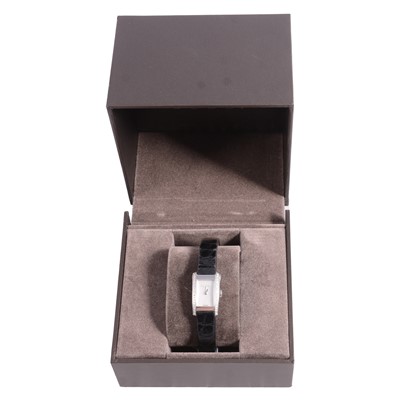 Lot 443 - Gucci - a lady's stainless steel quartz wristwatch with diamond set bezel.