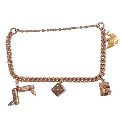 Lot 184 - A yellow metal charm bracelet and four charms.