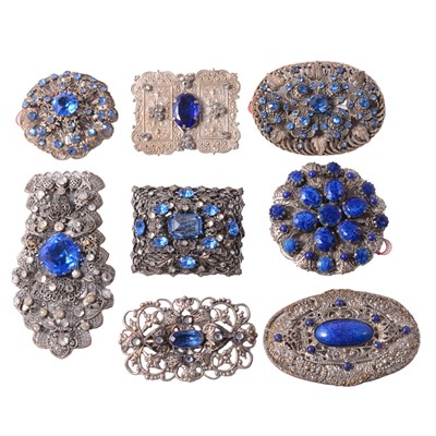Lot 491 - Eight 1930s Czechoslovakian white metal blue paste set brooches and clip.