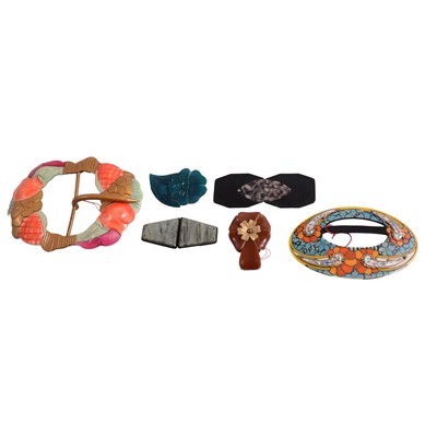 Lot 515 - A collection of vintage costume jewellery, bakelite, celluloid and plastic belt buckles and dress clips.