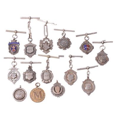 Lot 435 - Fourteen silver fobs and T bars.