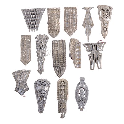 Lot 526 - Fourteen Art Deco large paste set single dress clips.