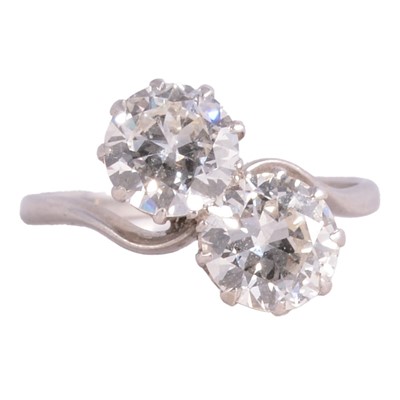 Lot 73 - A diamond two stone crossover ring.