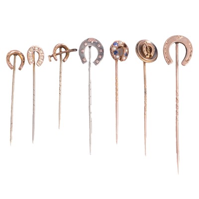 Lot 351 - Seven horseshoe stick pins.