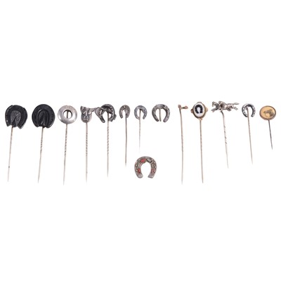 Lot 351 - Thirteen white metal and jet horse-related stick pins.