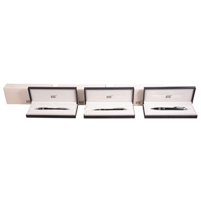 Lot 383 - Montblanc - Three Starwalker black resin retractable rollerball pens.