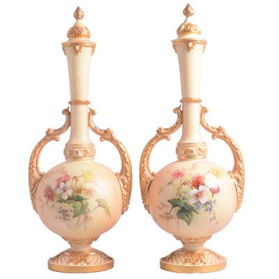 Lot 35 - Pair of Royal Worcester blush ivory twin handled vases with covers