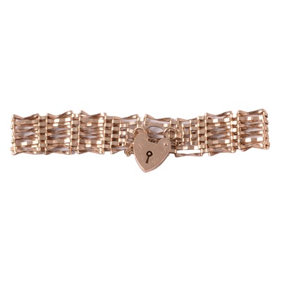 Lot 310 - A 9 carat yellow gold six bar gate link bracelet.