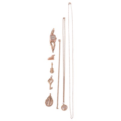 Lot 260 - Gold bracelet, charms, yellow metal charm, chains, and a lady's gold wristwatch.