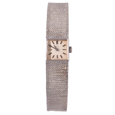 Lot 343 - Omega - a lady's 9 carat white gold manual wind bracelet wristwatch.