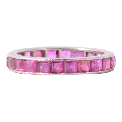 Lot 41 - A ruby full eternity ring.