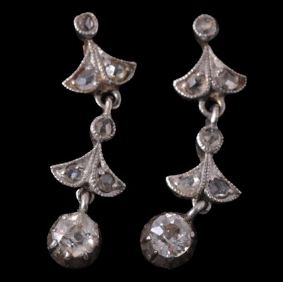 Lot 181 - A pair of delicate diamond drop earrings.