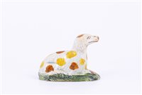 Lot 26 - Prattware model of recumbent dog, circa 1800,...