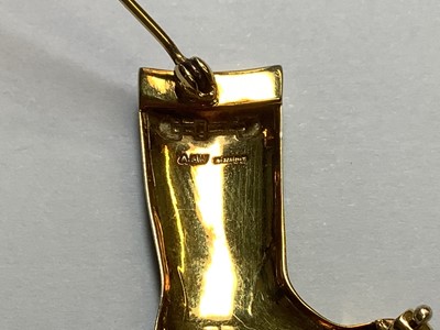 Lot 211 - Alabaster & Wilson - a 9 carat yellow gold and green enamel Wellington boot brooch.