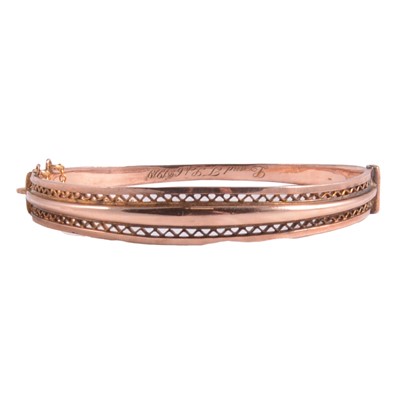Lot 298 - A 9 carat rose gold half hinged bangle.