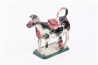 Lot 56 - Pratt type cow and milkmaid creamer,...