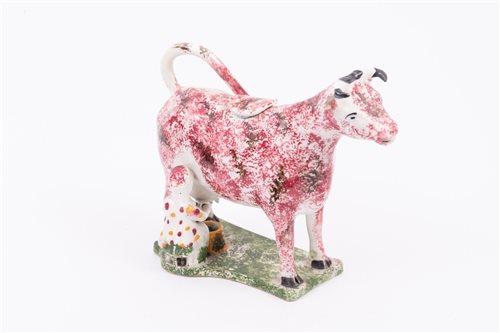 Lot 57 - Pratt type cow and milkmaid creamer, probably...