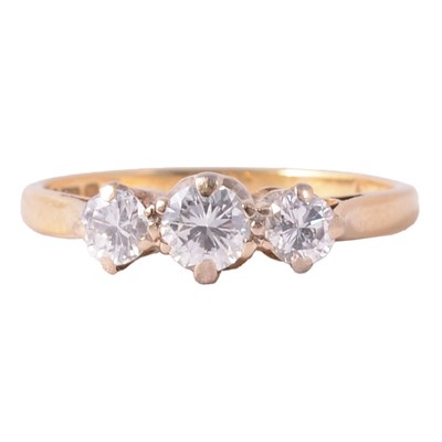 Lot 61 - A diamond three stone ring.