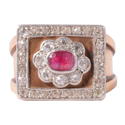 Lot 33 - A ruby and diamond square cluster ring on a heavy band.