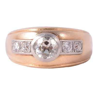 Lot 139 - A large diamond set yellow metal band ring.