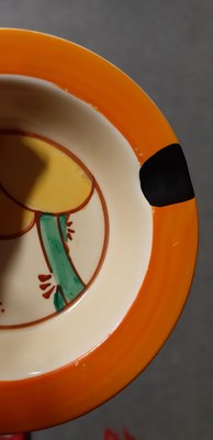 Lot 8 - Clarice Cliff, two ashtrays - 'Sunburst' and 'Summerhouse' pattern