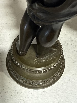 Lot 75 - Pair of bronze and cast brass figural candlesticks