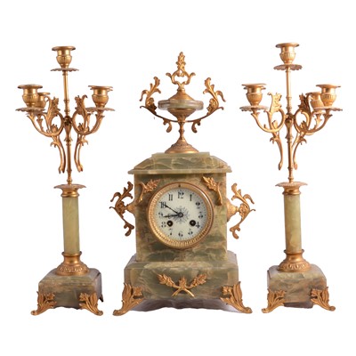 Lot 82 - French onyx and gilt metal three-piece clock garniture