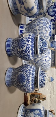 Lot 19 - Ten modern Chinese blue and white jars and covers