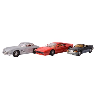Lot 218 - Four Burago scale model die-cast cars and others, plus a set of eight Motorsport posters